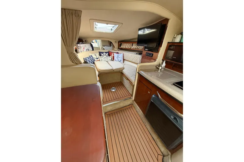 Slide: The Image of Interior of 2007 Sea Ray 280 Cuddy Cabin with cozy seating and modern amenities. - 5