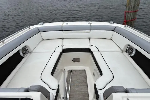 Slide: The Image of 2016 Sea Ray 270 Sundeck boat interior with white seating and water view. - 10