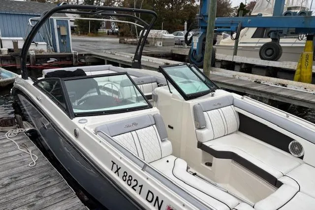 Slide: The Image of 2016 Sea Ray 270 Sundeck boat docked, featuring sleek design and comfortable seating. - 15