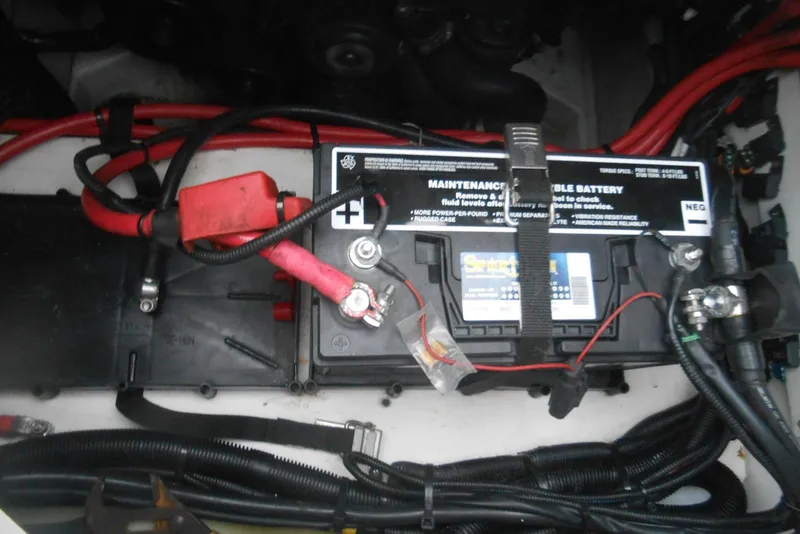 Slide: The Image of Battery compartment of 2016 Sea Ray 270 Sundeck with visible cables and connections. - 17