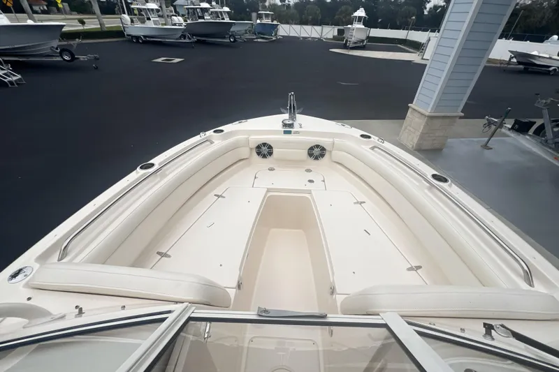 Slide: The Image of 2020 Grady-White Freedom 235 boat interior with seating and cup holders. - 10