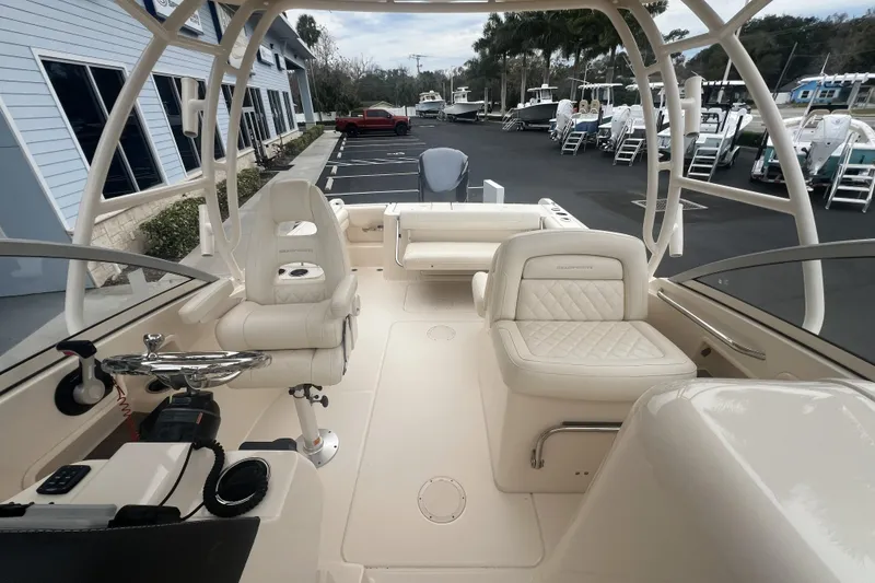 Slide: The Image of White YETI cooler on 2020 Grady-White Freedom 235 boat deck. - 11