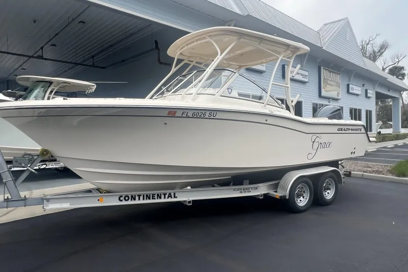 Slide: The Image of 2020 Grady-White Freedom 235 boat interior with storage compartment and mirror. - 14