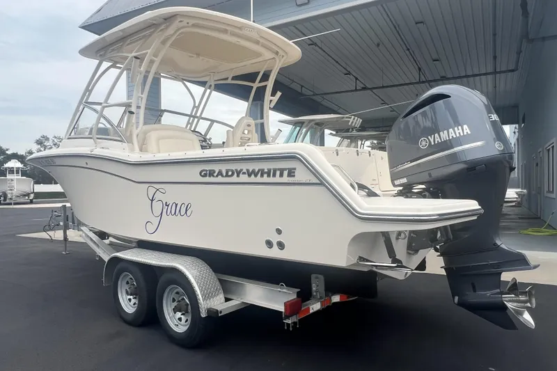 Slide: The Image of 2020 Grady-White Freedom 235 boat interior with helm and captain's chair. - 15