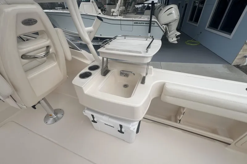 Slide: The Image of 2020 Grady-White Freedom 235 boat with Yamaha engine, parked on a trailer. - 3