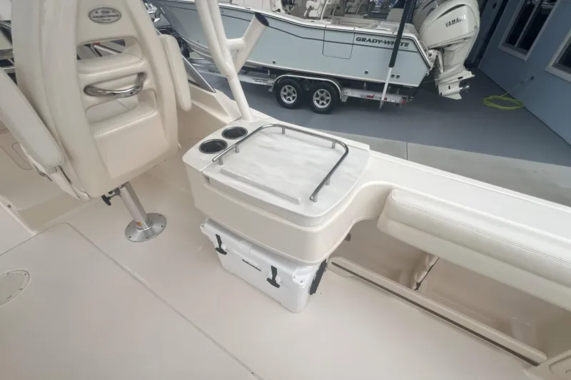 Slide: The Image of 2020 Grady-White Freedom 235 boat on trailer with Yamaha engine, parked outdoors. - 4