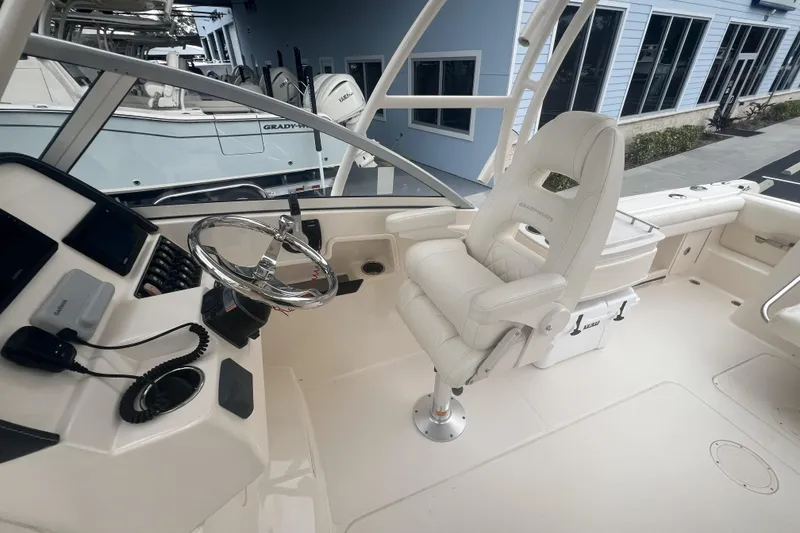 Slide: The Image of 2020 Grady-White Freedom 235 boat interior with sink and seating area. - 9