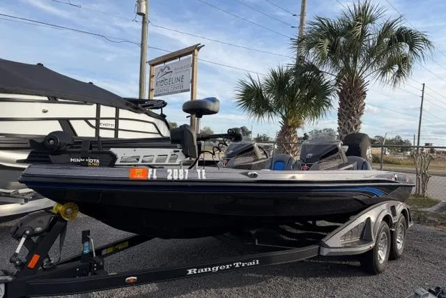 The Image of 2022 Ranger Z518 Tournament Elite fishing boat on trailer, parked outdoors. - 1