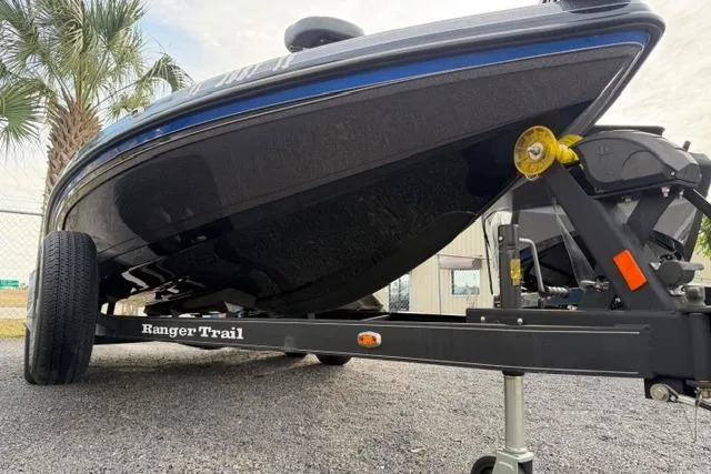 Slide: The Image of 2022 Ranger Z518 Tournament Elite boat on Ranger Trail trailer, parked outdoors. - 14
