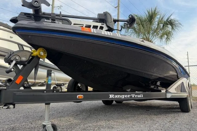 Slide: The Image of 2022 Ranger Z518 Tournament Elite boat on trailer, parked outdoors. - 15
