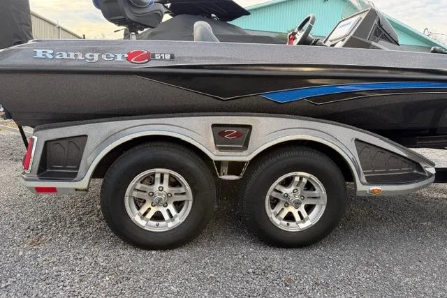 Slide: The Image of 2022 Ranger Z518 Tournament Elite boat on a dual-axle trailer, side view. - 17