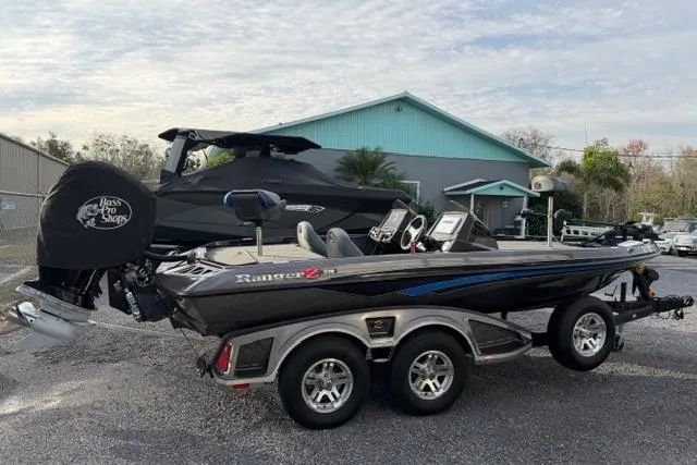 Slide: The Image of 2022 Ranger Z518 Tournament Elite fishing boat on trailer, parked outdoors. - 3