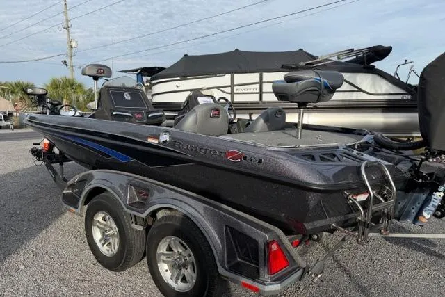 Slide: The Image of 2022 Ranger Z518 Tournament Elite fishing boat on trailer, parked outdoors. - 5