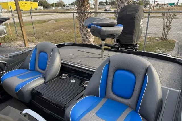 Slide: The Image of 2022 Ranger Z518 Tournament Elite boat interior with blue and gray seating. - 8