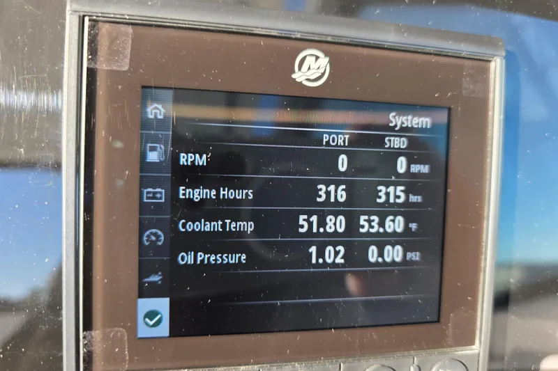 Slide: The Image of Display screen of a 2021 Blackfin 272 DC showing engine metrics and system status. - 13