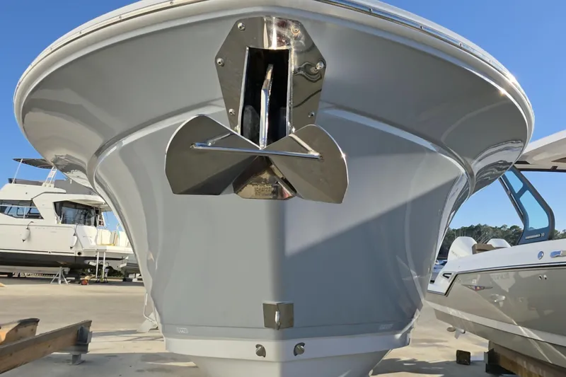 Slide: The Image of 2021 Blackfin 272 DC boat bow with anchor, docked in marina. - 4
