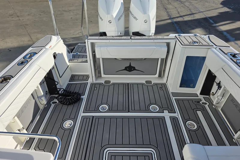 Slide: The Image of 2021 Blackfin 272 DC boat deck with sleek design and modern features. - 7