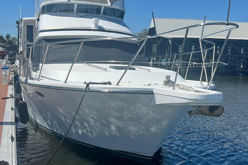 Slide: The Image of 1998 Hyatt 51 Aft Cabin Motor Yacht docked at marina. - 13