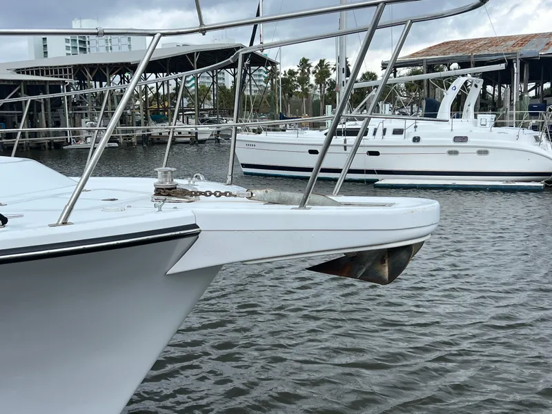 Slide: The Image of 1998 Hyatt 51 Aft Cabin Motor Yacht docked in marina, with another boat nearby. - 14