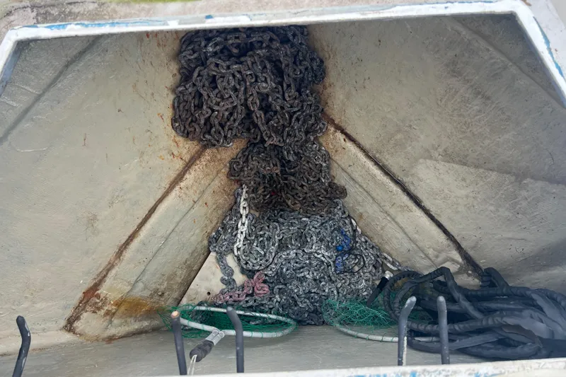 Slide: The Image of Anchor chain storage in 1998 Hyatt 51 Aft Cabin Motor Yacht. - 25