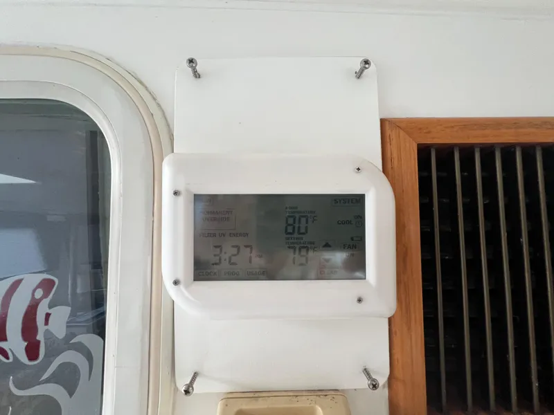 Slide: The Image of Thermostat display on 1998 Hyatt 51 Aft Cabin Motor Yacht, showing temperature and time. - 33