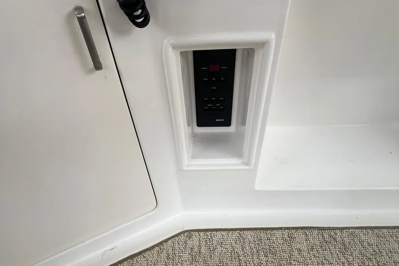 Slide: The Image of Control panel on 1998 Hyatt 51 Aft Cabin Motor Yacht interior. - 46