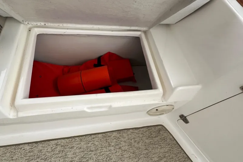 Slide: The Image of Storage compartment with life jackets on a 1998 Hyatt 51 Aft Cabin Motor Yacht. - 47