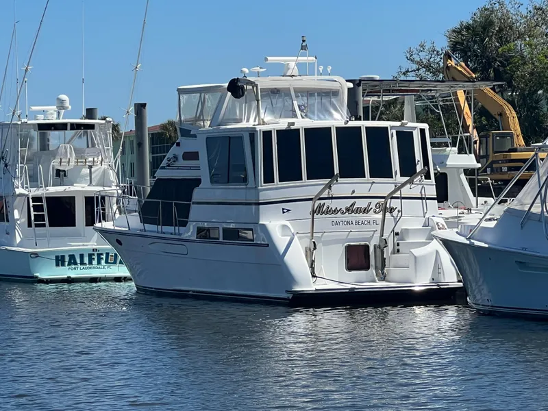 Slide: The Image of 1998 Hyatt 51 Aft Cabin Motor Yacht docked at marina, sunny day. - 5