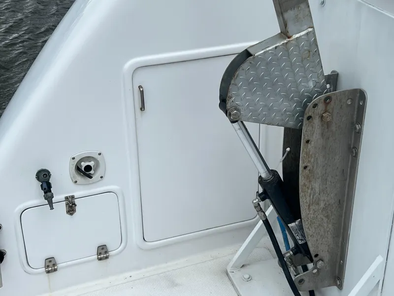 Slide: The Image of 1998 Hyatt 51 Aft Cabin Motor Yacht deck with hydraulic lift and storage compartments. - 9