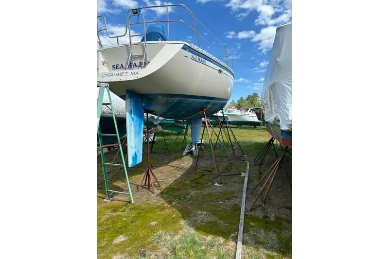 Slide: The Image of 1986 O'Day 40 sailboat on stands, Cataumet, MA, under clear blue sky. - 30