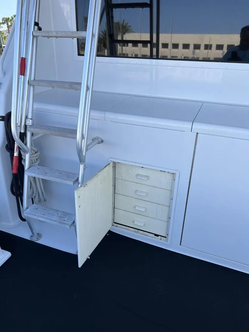 Slide: The Image of 1991 Viking Convertible yacht with ladder and open storage compartment. - 10