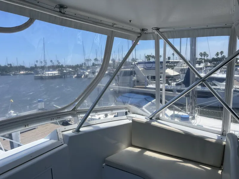Slide: The Image of Interior view of a 1991 Viking Convertible yacht in a marina. - 18