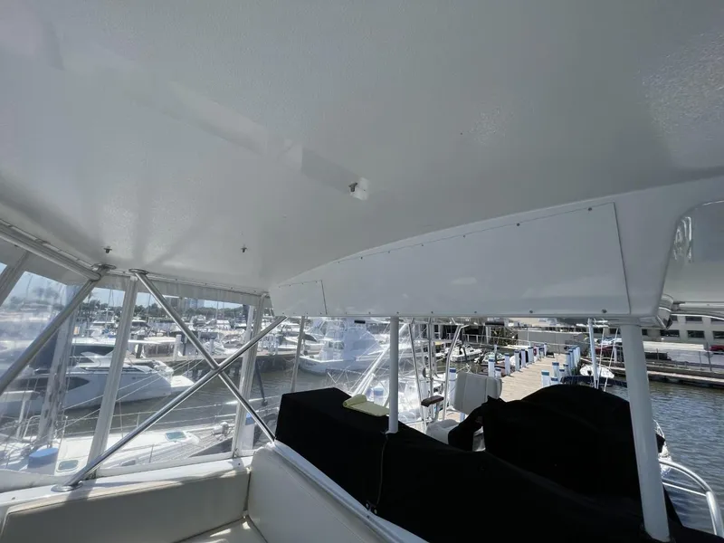 Slide: The Image of Interior view of a 1991 Viking Convertible yacht in the marina. - 19