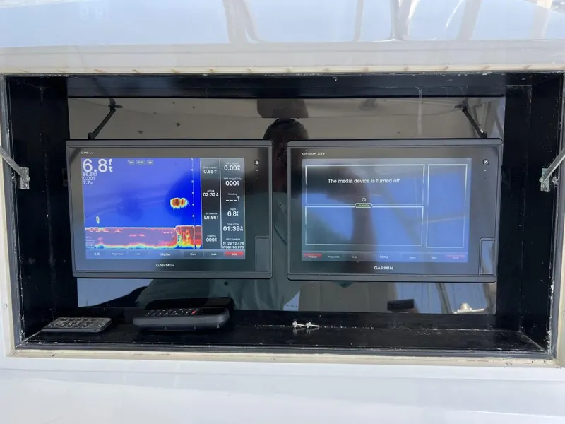 Slide: The Image of Navigation systems on a 1991 Viking Convertible boat. - 29