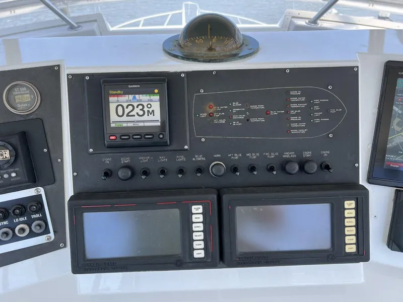 Slide: The Image of Dashboard of a 1991 Viking Convertible boat with navigation instruments. - 34