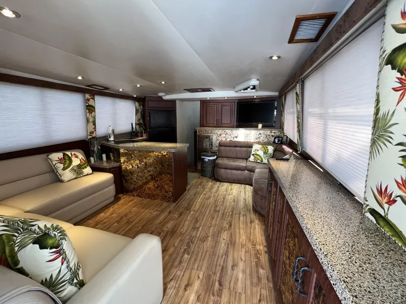 Slide: The Image of Luxurious interior of a 1991 Viking Convertible yacht with modern decor and tropical accents. - 36
