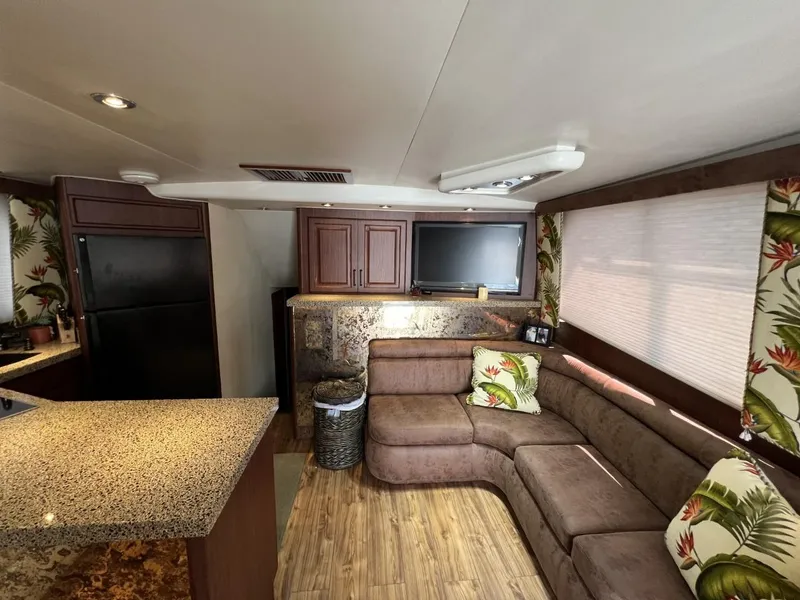Slide: The Image of Luxurious 1991 Viking Convertible interior with modern kitchen and cozy seating area. - 41