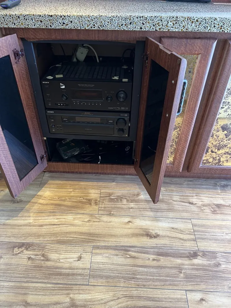 Slide: The Image of 1991 Viking Convertible interior with open cabinet revealing audio equipment. - 43