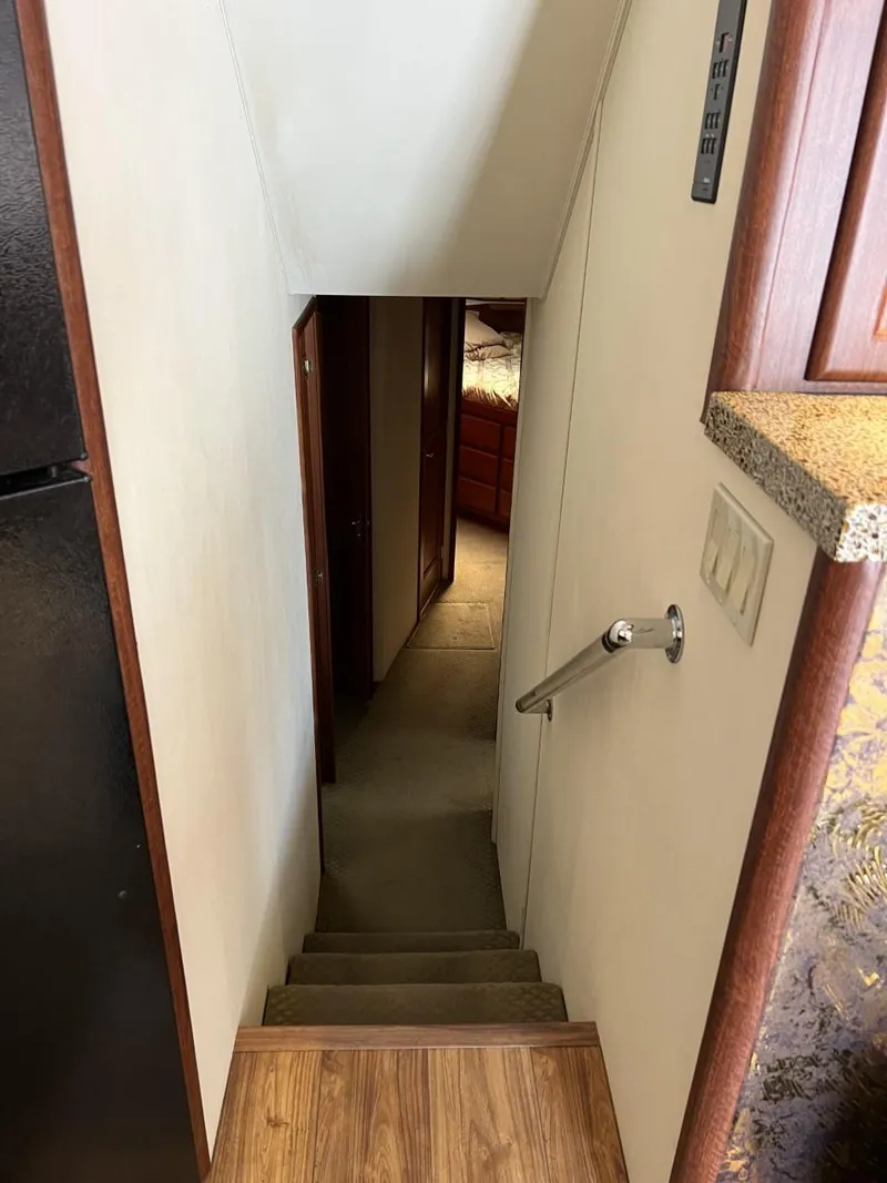 Slide: The Image of Staircase inside 1991 Viking Convertible yacht, leading to lower cabin area. - 49