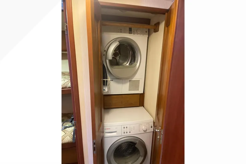 Slide: The Image of Stacked washer and dryer in 1991 Viking Convertible boat interior. - 54