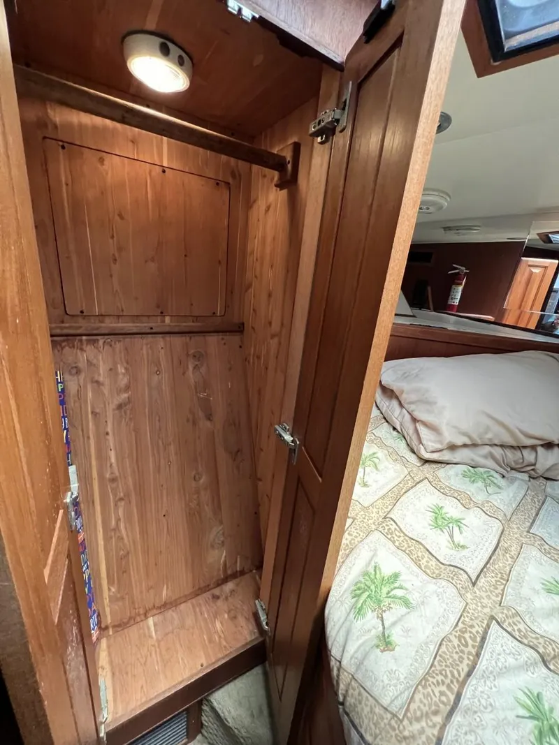 Slide: The Image of 1991 Viking Convertible interior with wooden closet and cozy bed. - 56