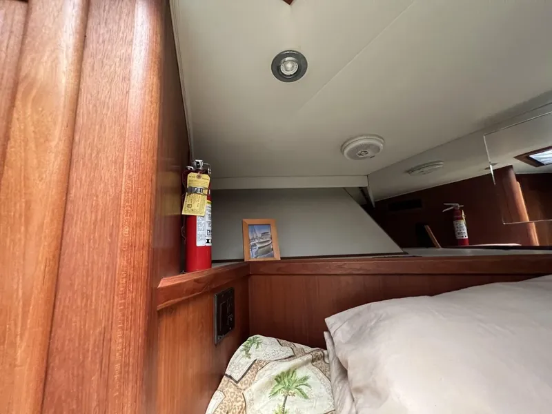 Slide: The Image of 1991 Viking Convertible cabin interior with fire extinguisher and framed photo. - 60