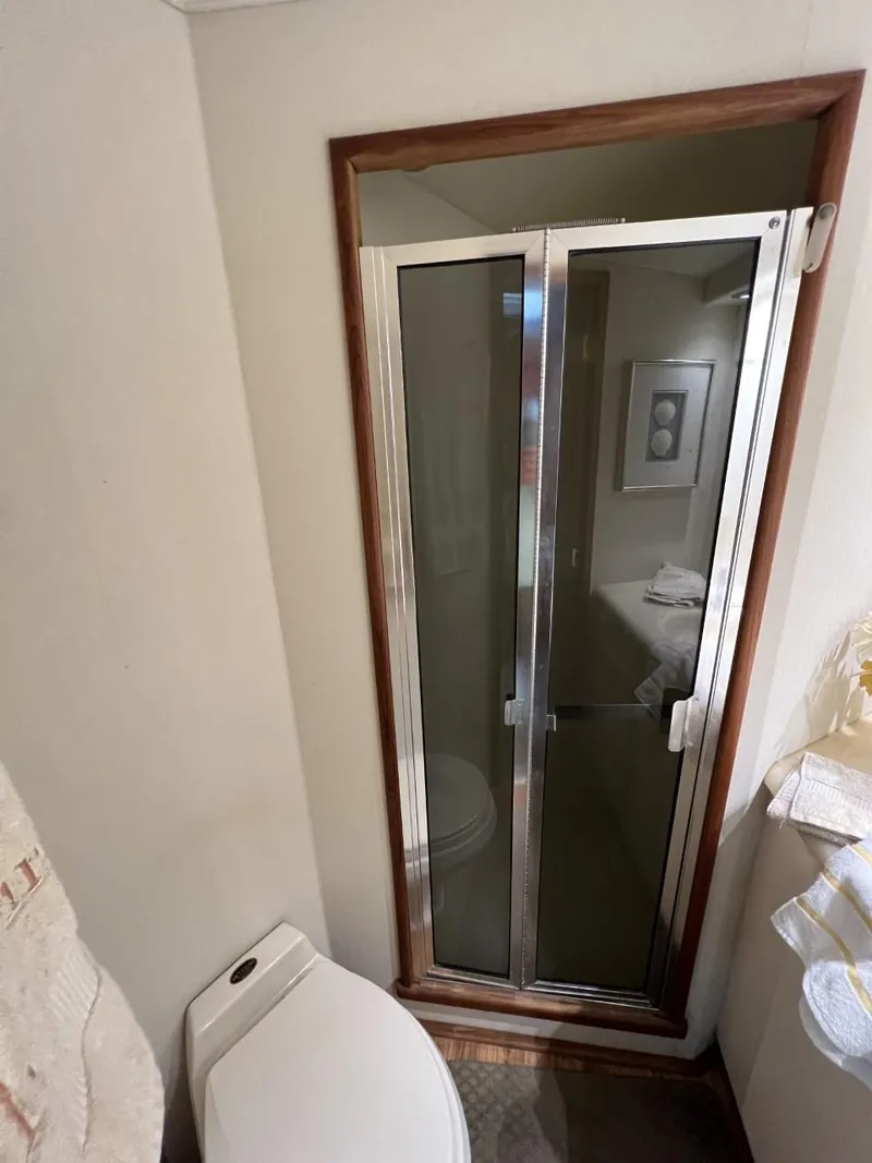 Slide: The Image of 1991 Viking Convertible bathroom with shower and toilet, featuring modern fixtures and compact design. - 68