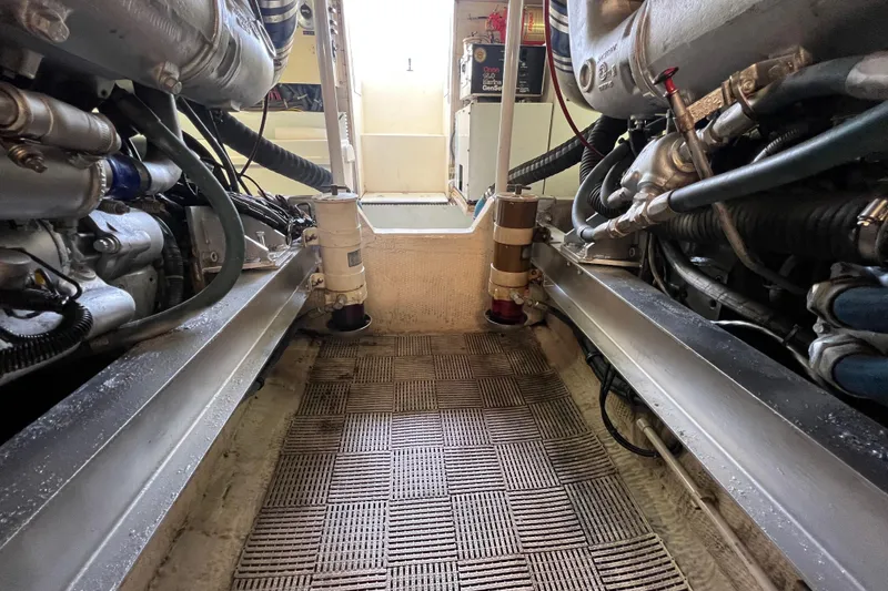 Slide: The Image of Engine room of a 1991 Viking Convertible boat, showcasing mechanical components. - 72