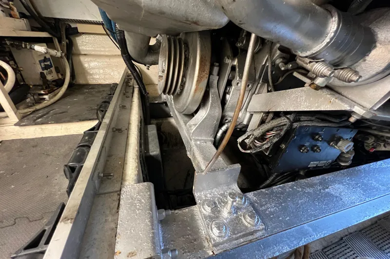 Slide: The Image of Engine compartment of a 1991 Viking Convertible boat, showing mechanical components and wiring. - 80