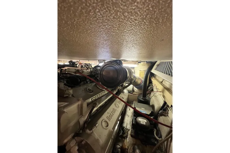 Slide: The Image of Engine room of a 1991 Viking Convertible boat, featuring Detroit Diesel components. - 86