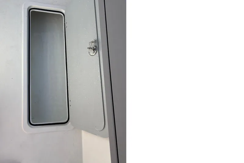 Slide: The Image of Open storage compartment on Defiance Admiral 220 EX boat, 2026 model. - 14