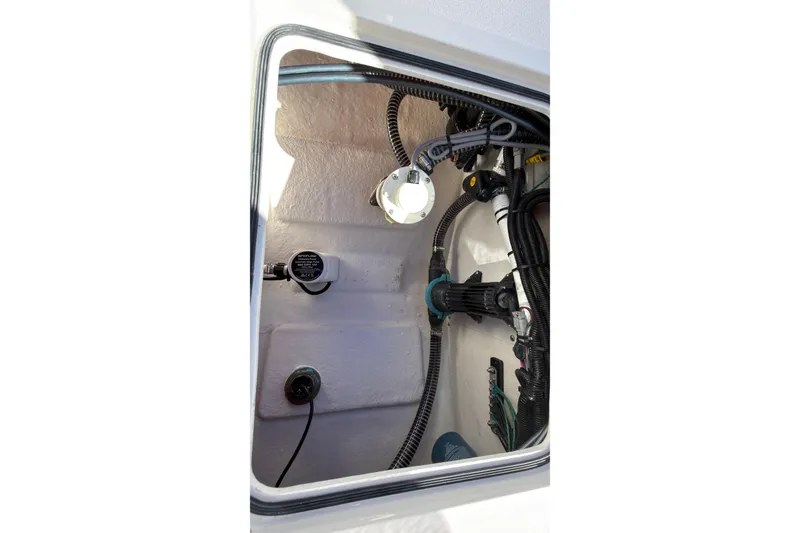 Slide: The Image of Interior view of 2026 Defiance Admiral 220 EX boat wiring and components. - 16
