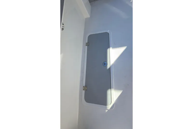 Slide: The Image of Hatch door on 2026 Defiance Admiral 220 EX boat interior. - 17