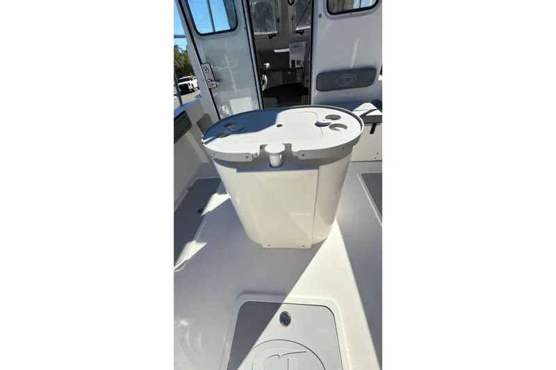 Slide: The Image of 2026 Defiance Admiral 220 EX boat interior with storage compartment and seating. - 19